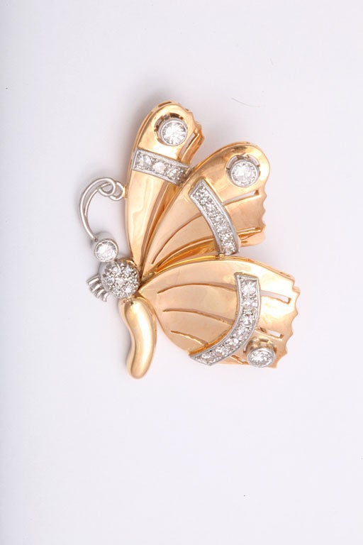 Beautifully designed butterfly brooch graces any outfit.  The diamonds are set in platinum and the main body of the brooch in 18k pink gold.
