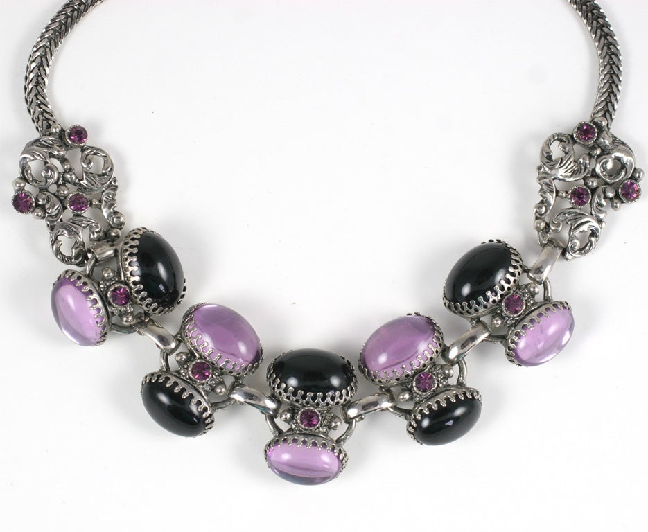 Dramatic amethyst and jet style, prong set  oval cabochon necklace and earrings in silvertone metal. Earrings are 1 inch by 1.5 inches.