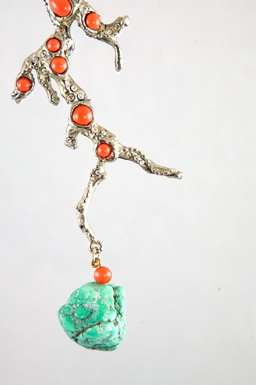 These ear clips are straight off the Valentino runway!  Absolutely stunning, these cast coral form ear clips are set with glass Coral and are finished with a dangling tumbled Turquoise stone.