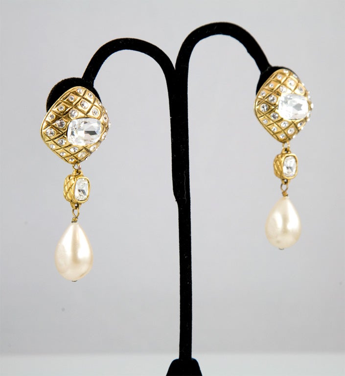 Beautiful and dazzling pair of earrings from the house of Chanel.  These ear clips feature brilliant rhinestone set in 