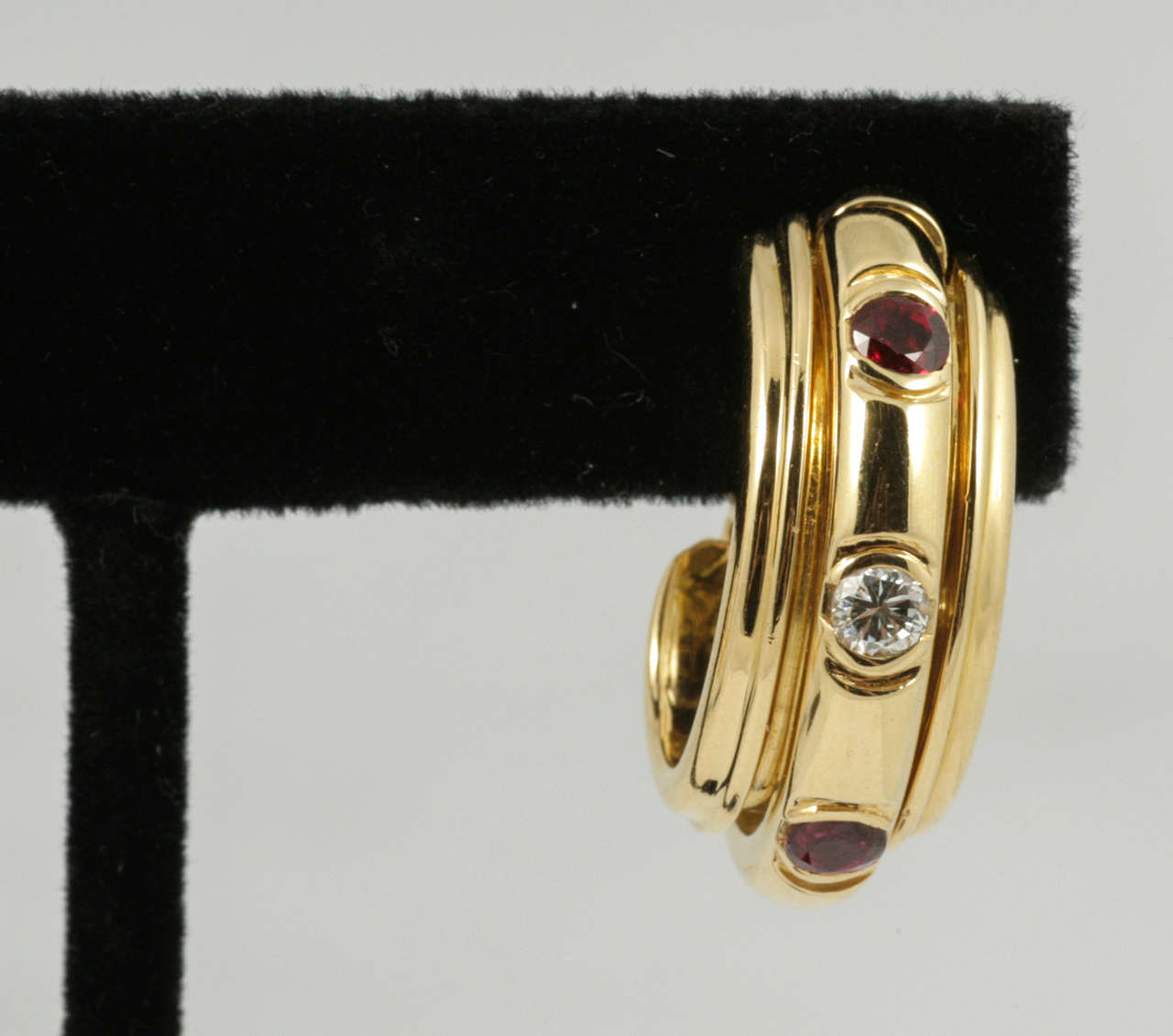 Elegant pair of 18ct yellow gold, ruby and diamond earrings from the 