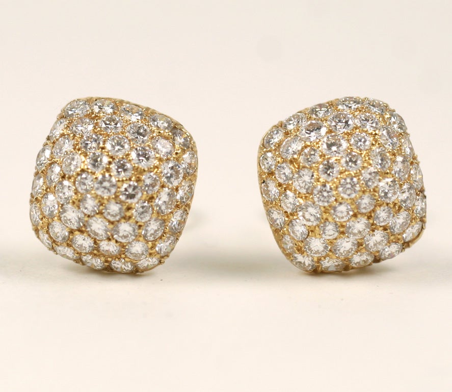 Classic cushion puff shaped gold and diamond ear clips. Signed Oscar heyman & Bros and numbered.