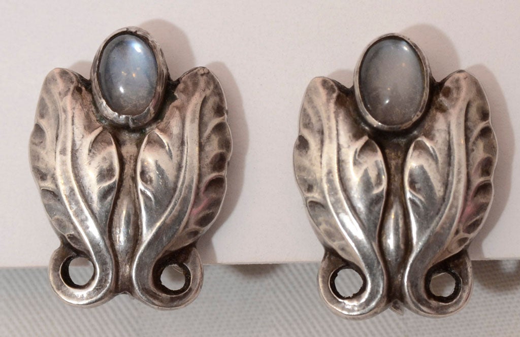 Georg Jensen beautiful art nouveau earrings, sterling, each set with a cabochon moonstone, old mark, each signed GI Denmark, 1C circa 1909 - 1914, measuring 3/4
