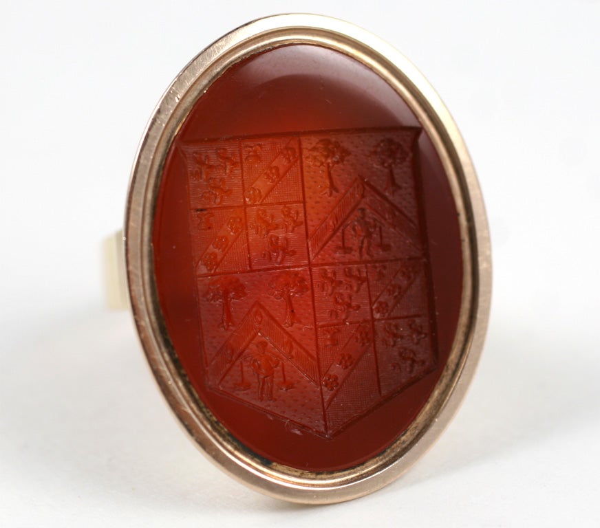 A fascinating carved carnelian intaglio from the Georgian Period abundant wiith crisply carved decipherable symbols.  We can read but not fully understand the why or wherefore of the signs, as this is a rebus or puzzle in which the symbols had