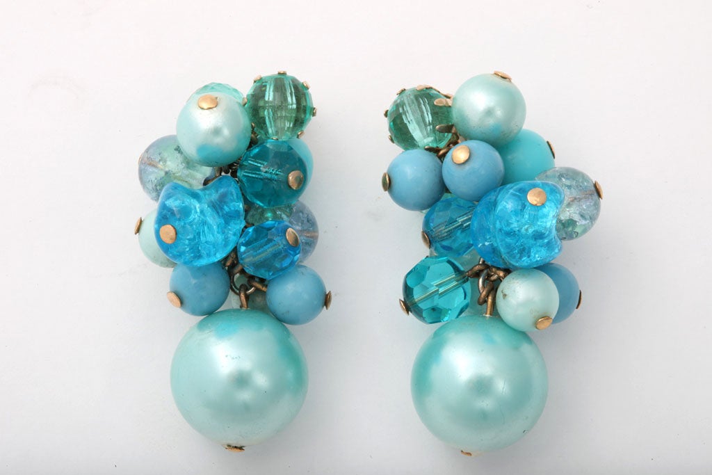 Dangle earrings of aqua beads.