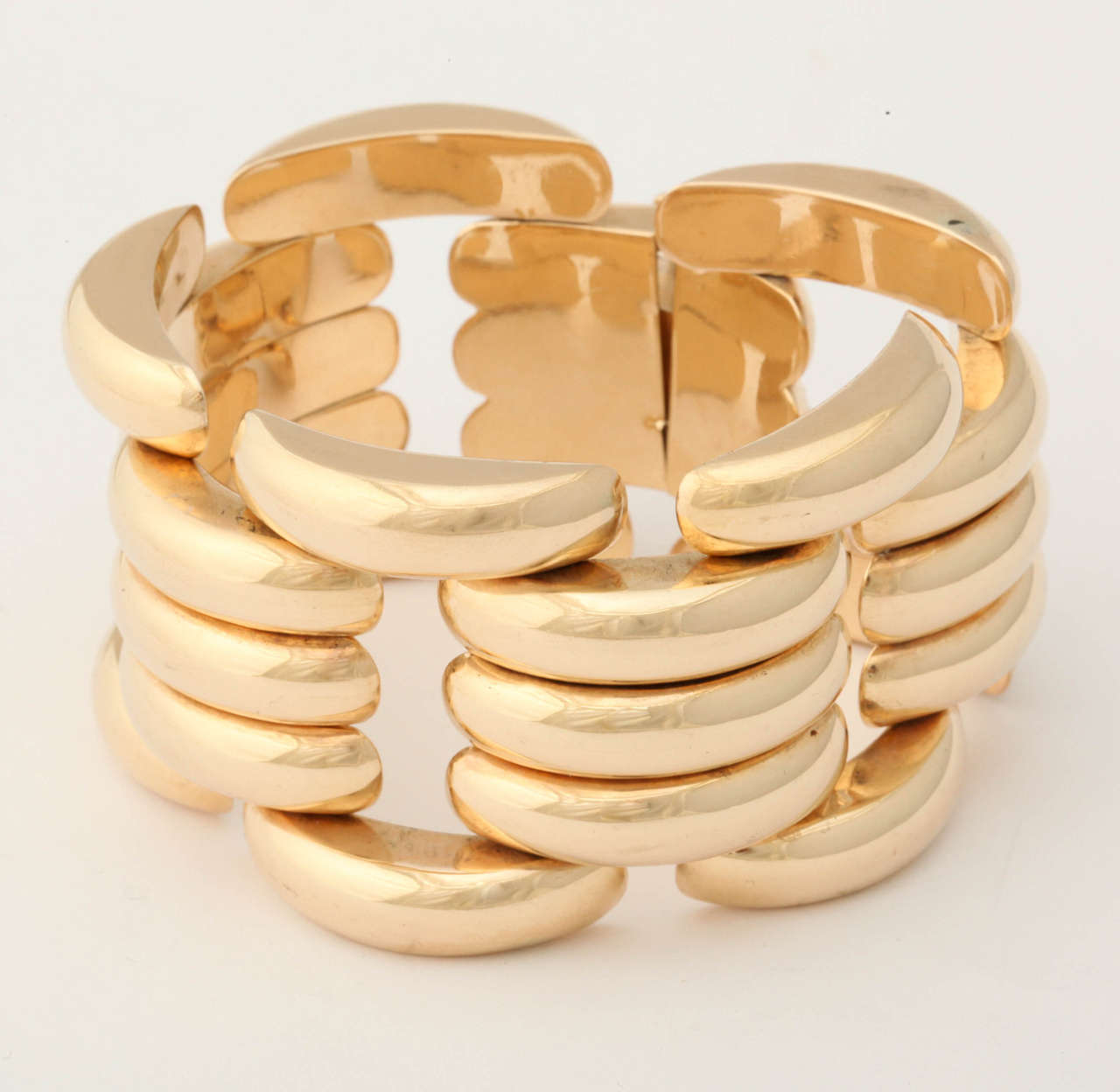 14 KT Yellow Gold Open Link Bracelet Consisting of a Triple Ridge Effect in Center of Bracelet Further Designed with Single Curved Ridges on the Edges of the Bracelet.

Very Flexible When Worn Exhibiting A Very High Polish Yellow Gold