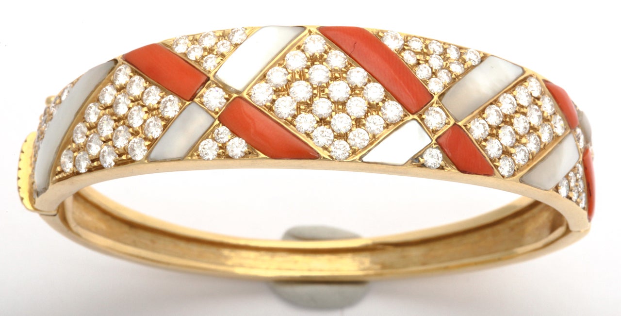 Gorgeous coral and diamond and mother of pearl criss cross bangle bracelet set with 4 carats of high quality full cut diamonds
