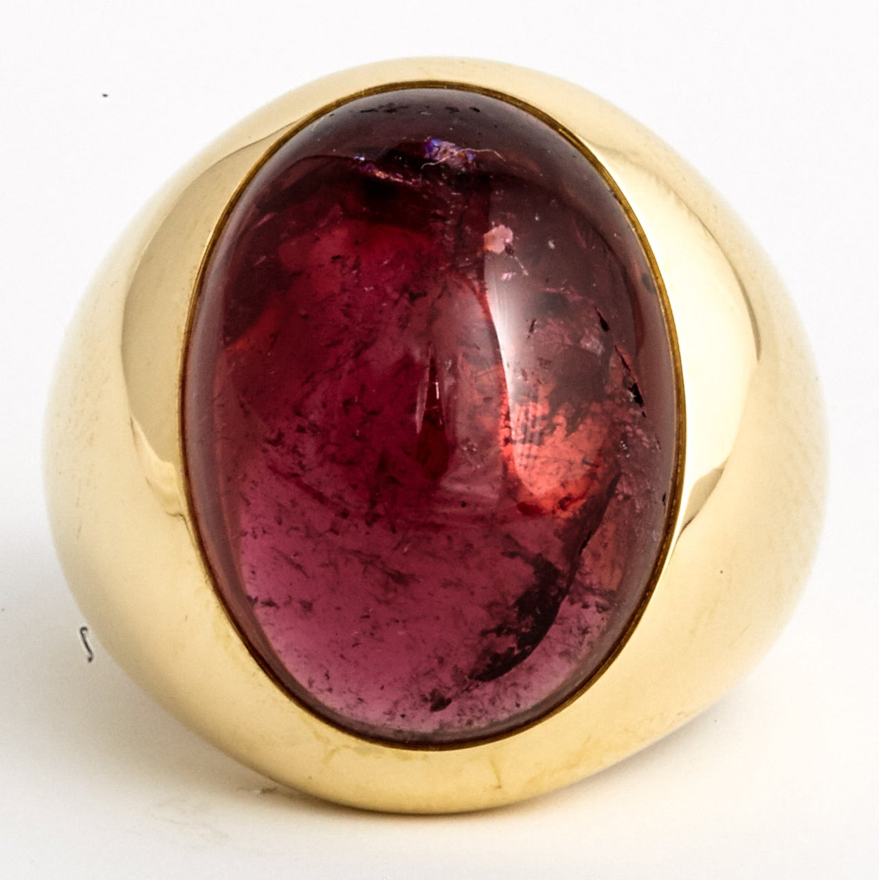 An 18 ct golden Narciso cocktail ring by Pomellato, centering a deep pinkish red oval shaped cabochon cut Rubelite. (the name given to reddish-pink tourmaline).Signed by the maker and hallmarked. Ring size 53 ½.

All of our prices exclude VAT.