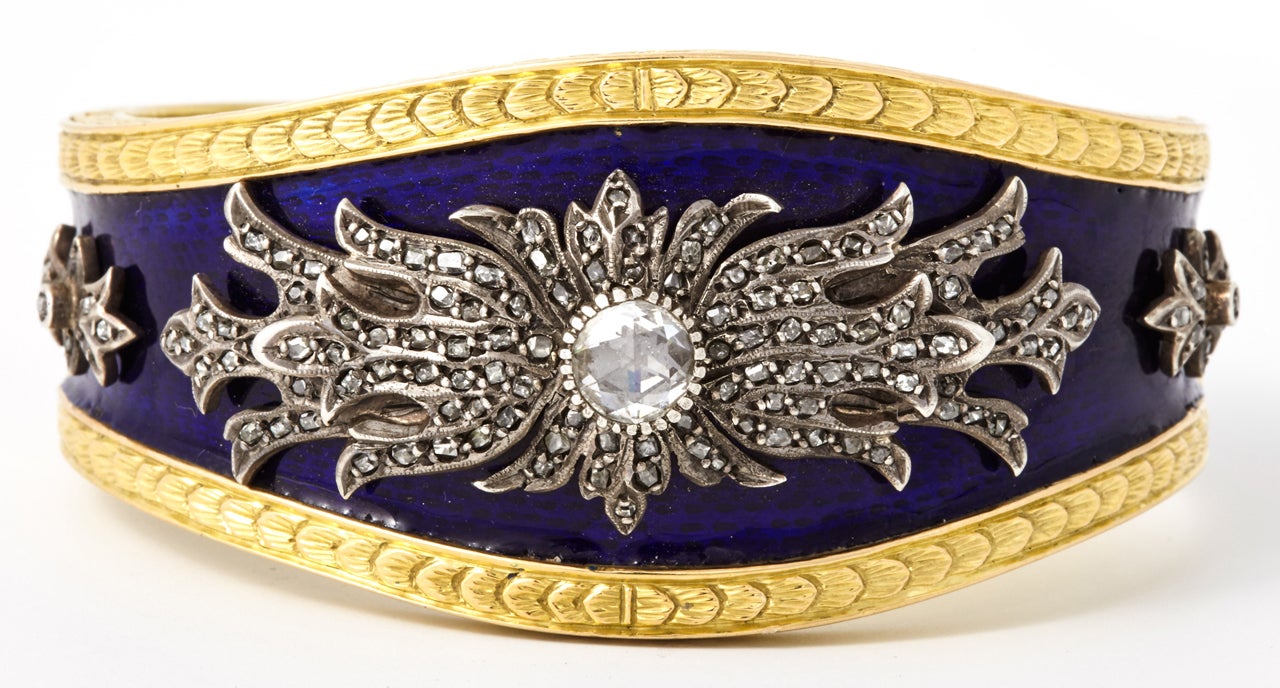 An golden enameled diamond bracelet