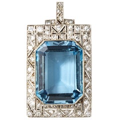 An Art Déco aquamarine and diamond pendant and brooche