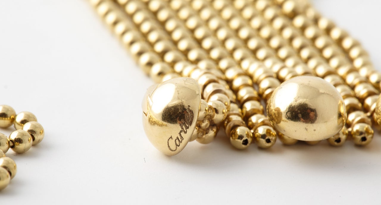 A gold and diamond draperie ball necklace by Cartier 3