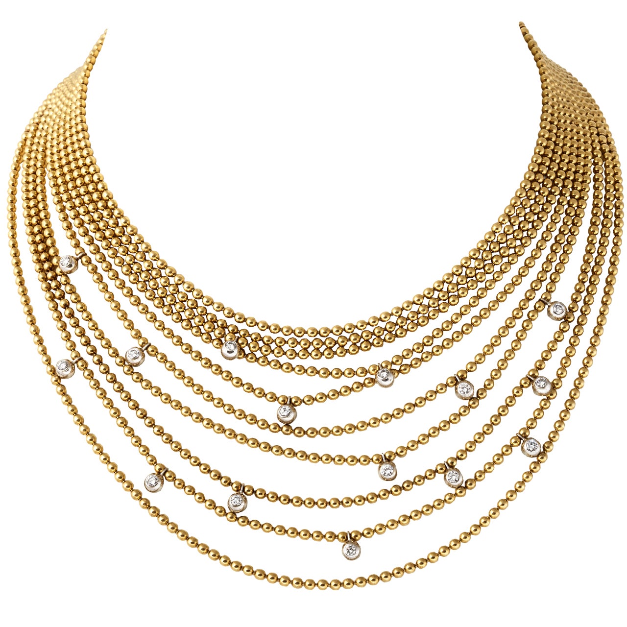 A gold and diamond draperie ball necklace by Cartier