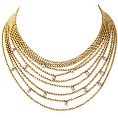 Vintage A gold and diamond draperie ball necklace by Cartier