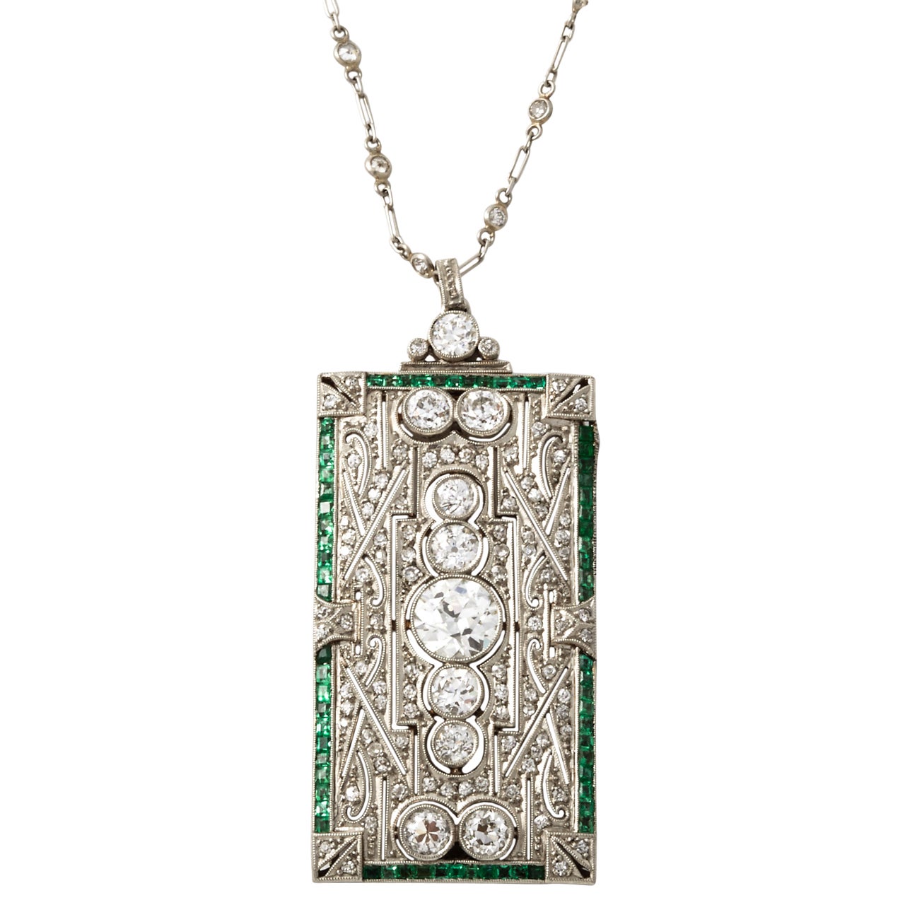 An Art Deco platinum emerald diamond brooche/pendant For Sale