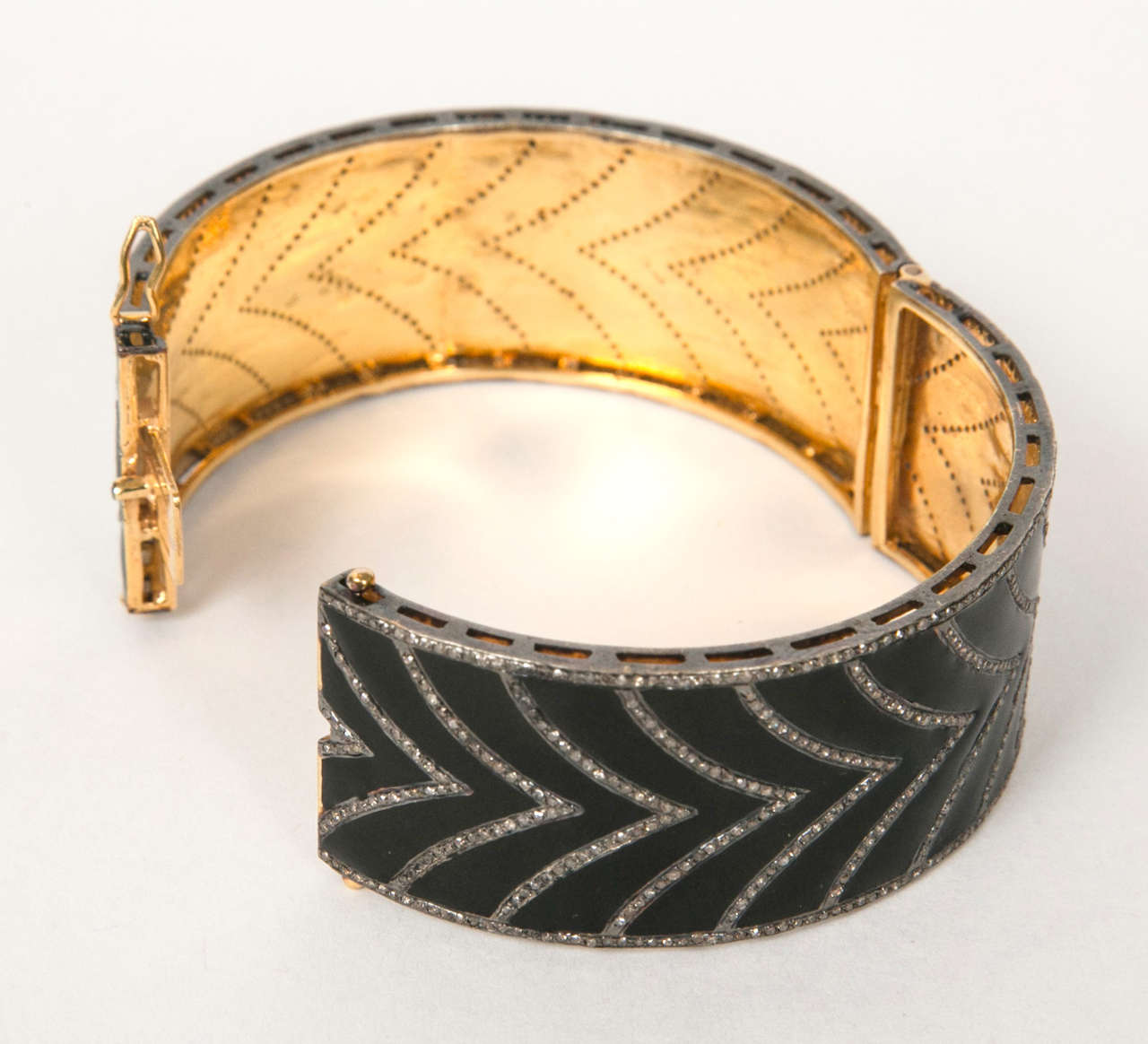 Black enamel and diamond cuff bracelet .