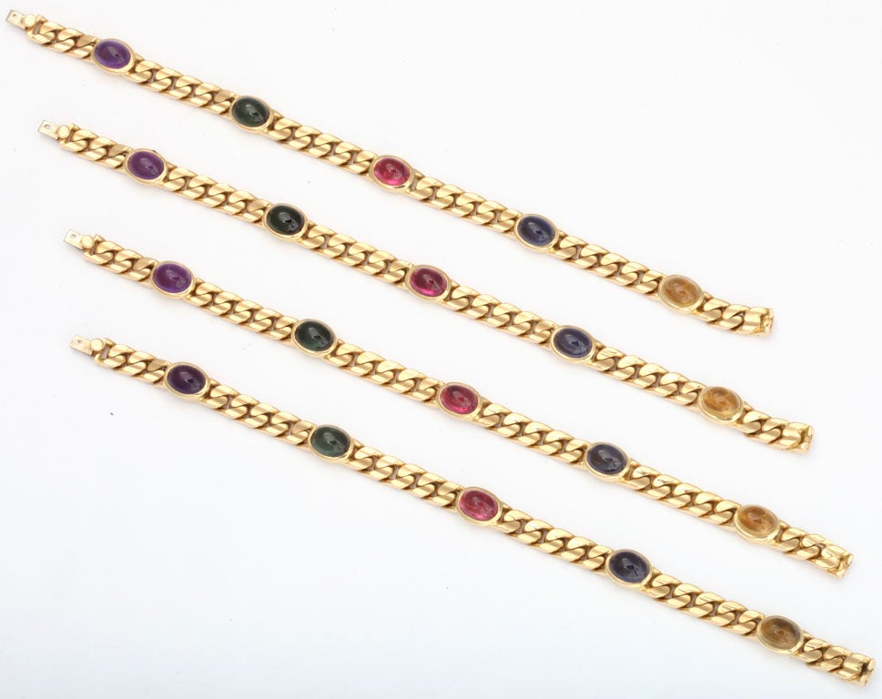 Three 18kt Yellow gold Bracelets identically set with Cabochon Amethyst, Tourmaline, Rubellite, Sapphire & Citrine  - bezel set &  forming any combination of bracelets or Chains.  Signed PD. and weighing 94.9Dwt.  37