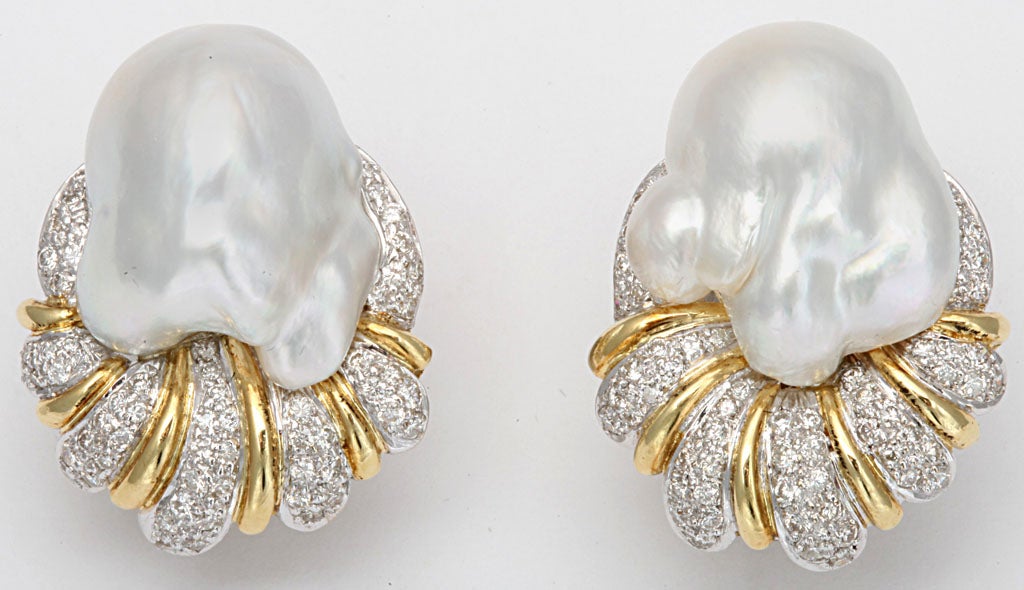 Unique Matching South Sea Pearl Earrings set in 18kt White & Yellow Gold - pave set with full cut clean & White Diamonds.  Clip on with 18ky Omega Backs.