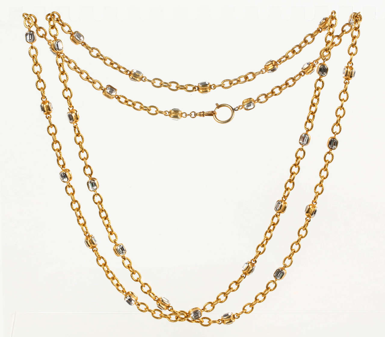 A chic Chanel sautoir, with a rope detailed chain punctuated by double sided faceted crystals. This sautoir is long enough to be worn doubled, tripled, or even quadrupled, as a choker, by virtue of the clasp at the top. Marked with the 