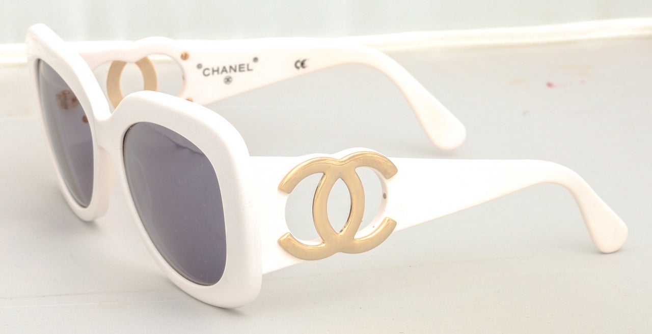 Chanel white sunglasses with large gold CC