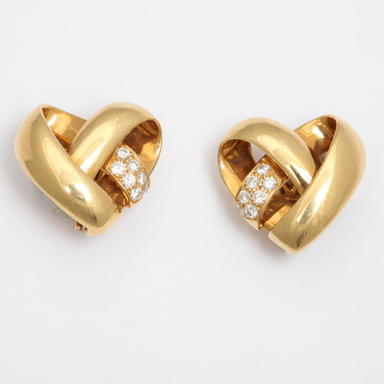 VCA Heart Shaped Earrings made up of inter woven bands set with very fine round Diamonds (E-F,VS).