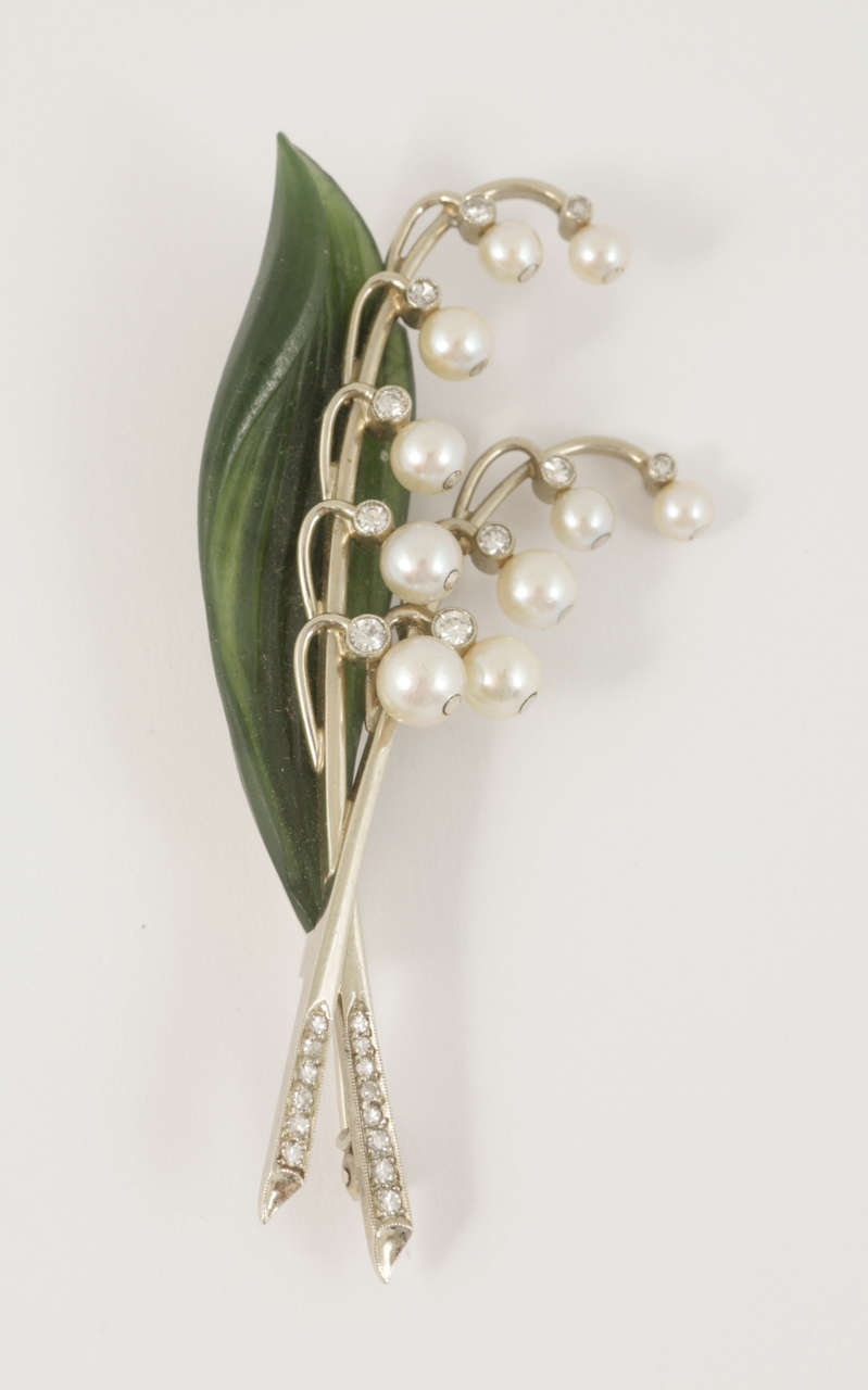 Austrian diamond, natural pearl and nephrite Lily of the valley spray brooch, c1940.