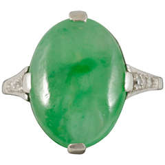1920s Jade Single Stone Ring Set Diamond Shoulders Mounted in Platinum and Gold