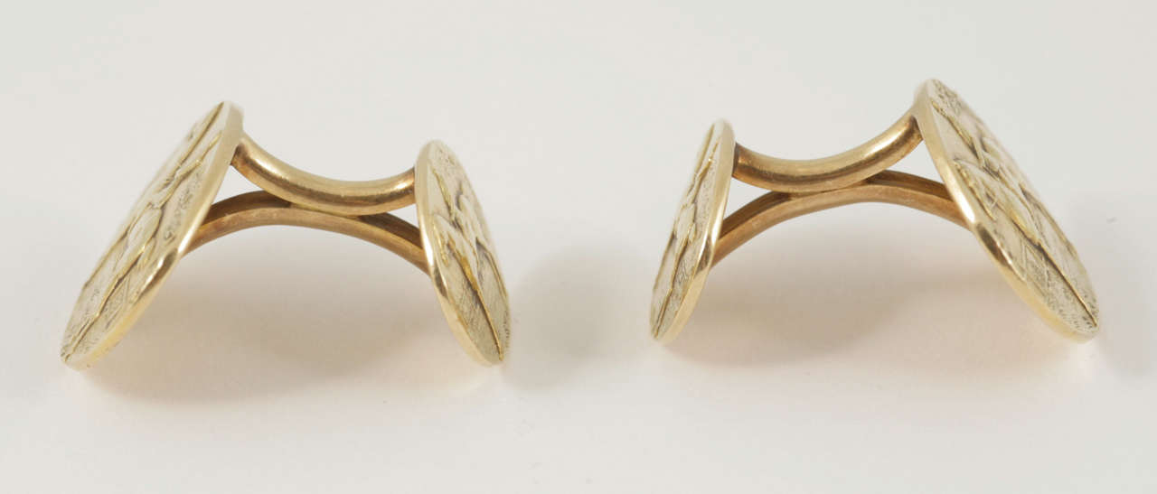 Pair of American 14k gold cufflinks, back and front of two sizes of racehorse and jockey, circa 1895.