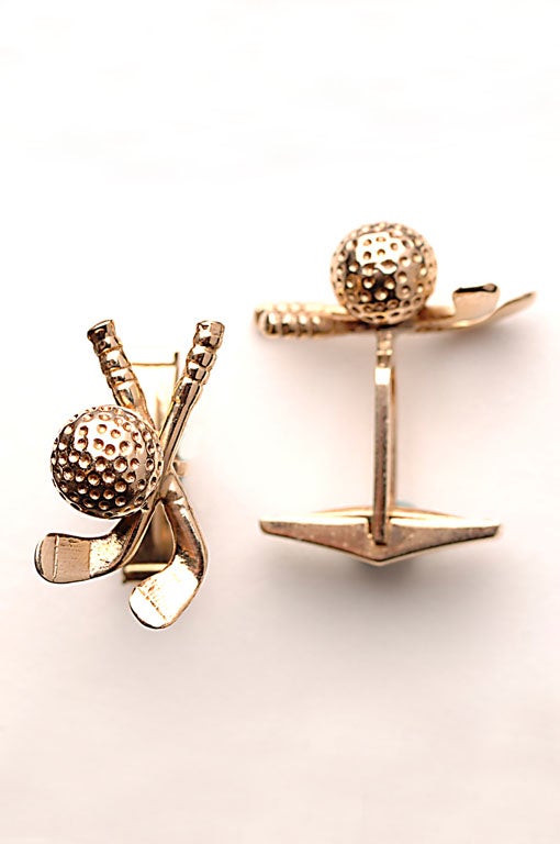Fourteen karat gold cufflinks with golf ball and two clubs. Perfect for the sportsman or woman.