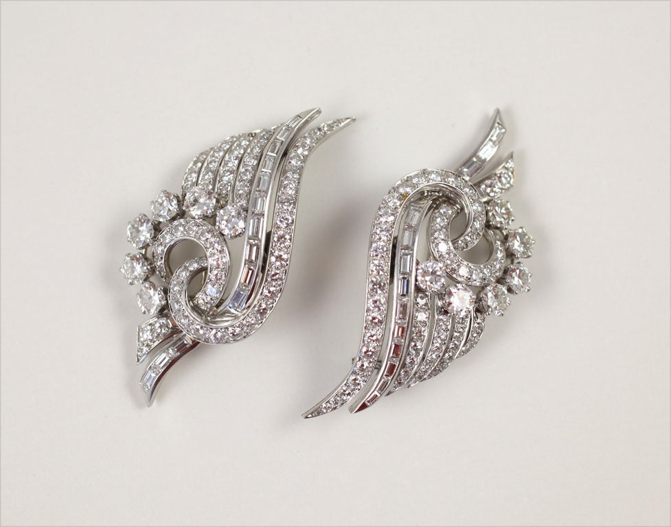 French scroll double clips<br />
102 round diamonds 7.50 carats<br />
26 baguette diamonds 2.50 carats<br />
12 round brilliants  4.50 carats