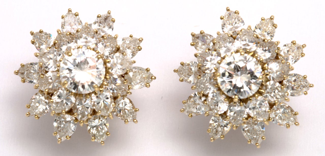 A stunning diamond cluster earrings designed by Jacques Timey for Harry Winston. The center stones for these magnificent jewel are GIA certified. The center stones weigh 1.32 and 1.31 carats and are surrounded by  approximately 10 carats of