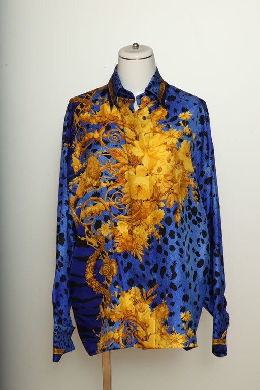Beautiful Gianni Versace silk shirt with flower and animal print and gold buttons.