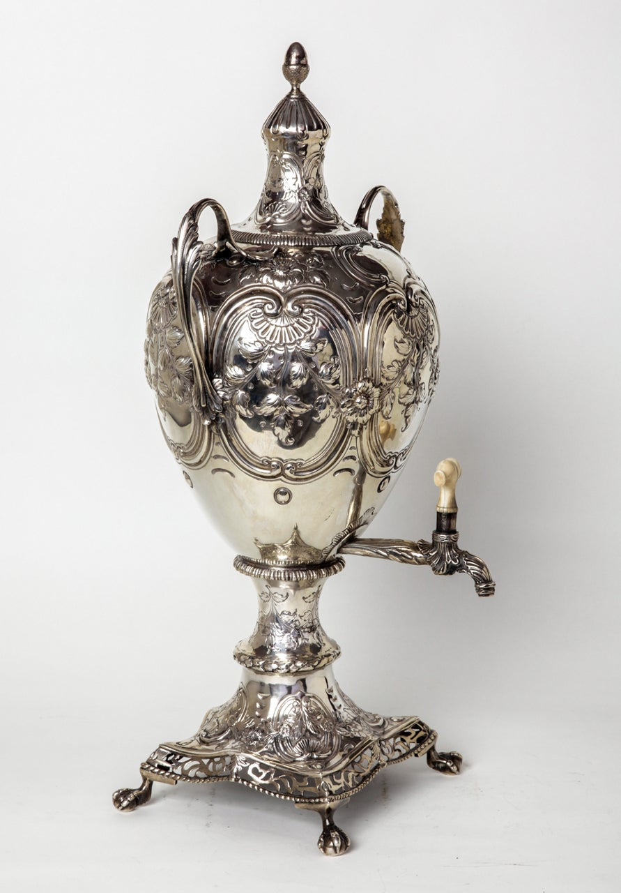 The George III Tea Urn presents a decorated body with 