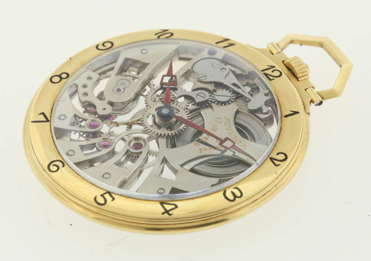 Juvenia 18k yellow gold skeleton pocket watch, circa 1980s, 46mm, with enameled Arabic hours on the bezel, manual-wind 17-jewel movement, dark red enamel hour and minute hands. Movement warrantied by Aaron Faber for 18 months.