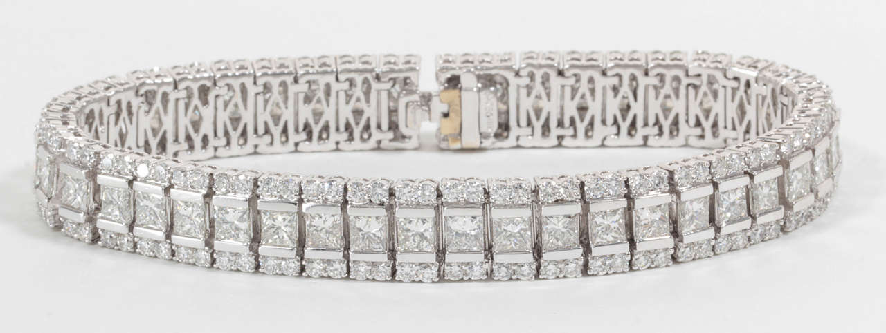 A beautiful bracelet for those looking for something a little wider and more unique than the classic tennis bracelet. 

15.60 carats of princess and round brilliant cut diamonds set in 18k white gold. 

Approximately .36 inches wide.