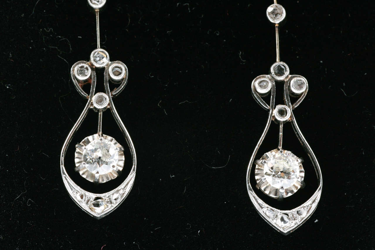 Edwardian Platinum set Diamond drop earrings with knife edge settings.