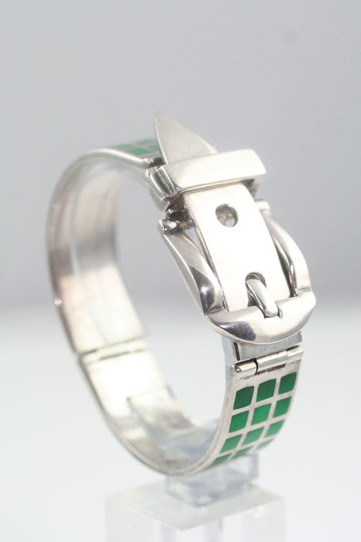 A chic sterling silver buckled bracelet inset with green enamel. Stamped 