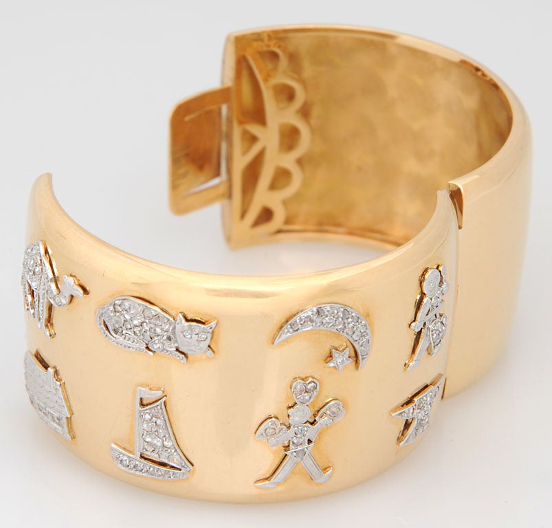 gold bangle with charms