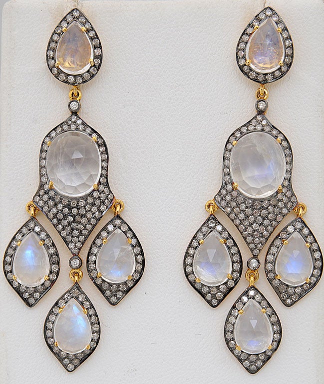 Substantial diamond and moonstone earrings set in silver with a 14k back.