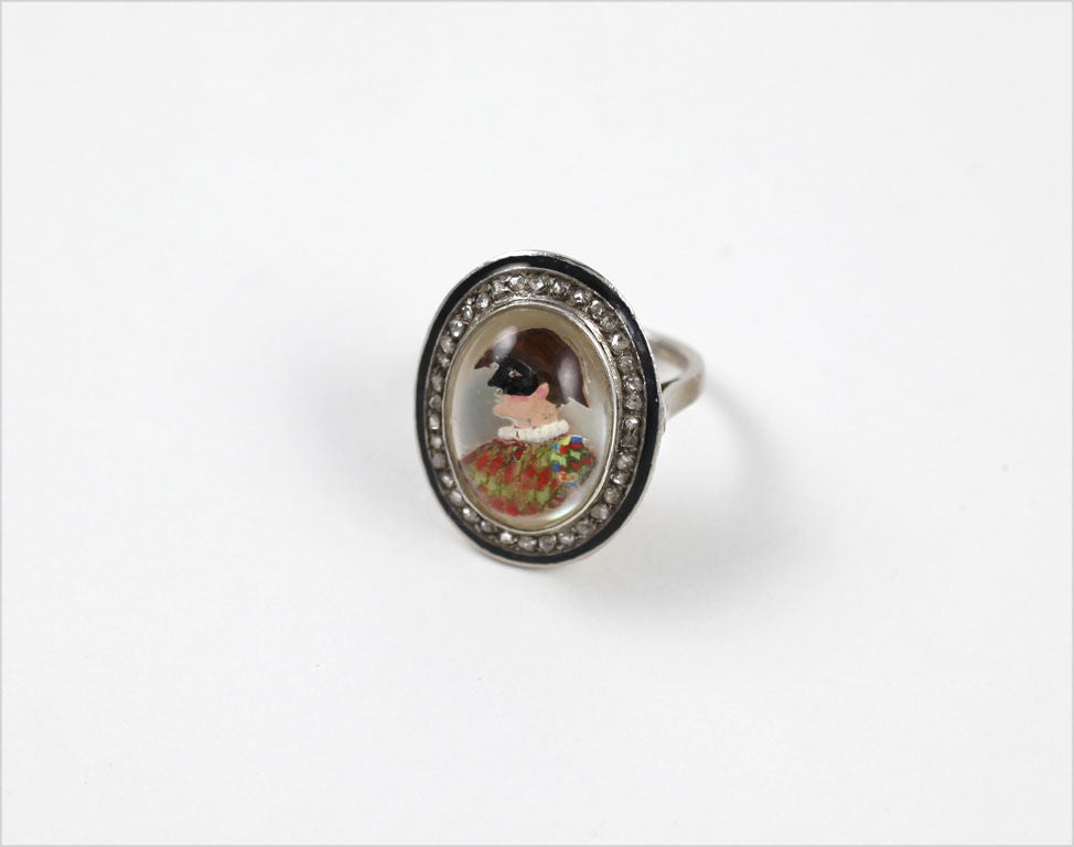 An extremely rare reverse crystal ring (reverse crystal intaglio) of a Venetian male celebrating the festival of the Carnevale di Venezia. The parade  and wearing of a mask and costume is one of the oldest recorded festivals in Italy. Believed to