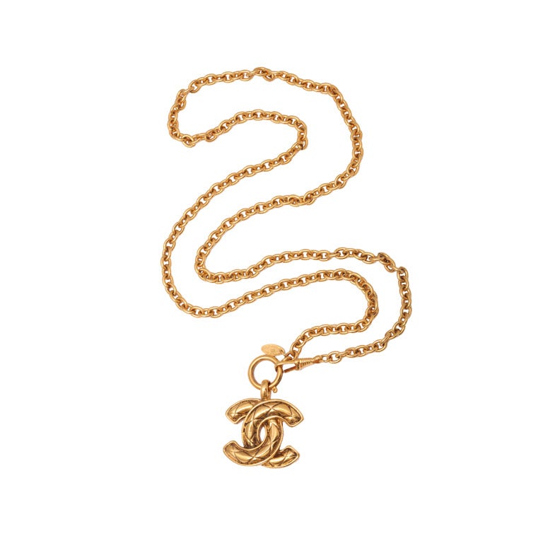 Chanel quilted cc motif necklace. Chain length 22 inches, CC motif 0.9 by 1.1 inches.
