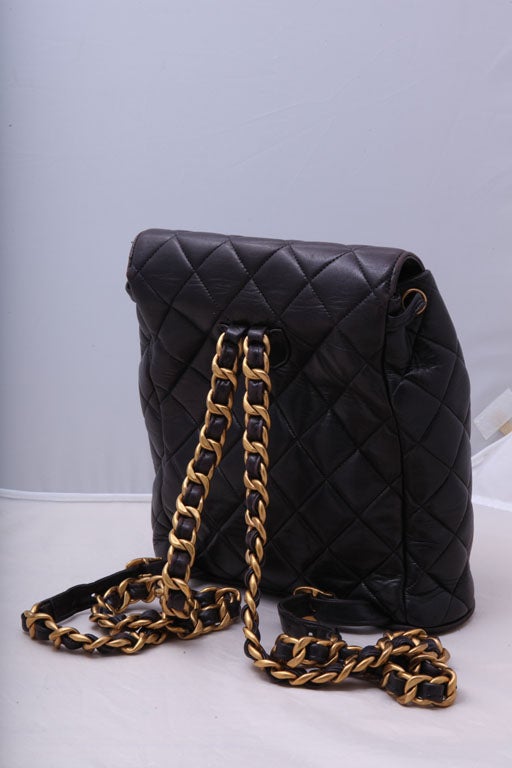 Chanel quilted backpack in dark brown. It has dark brown and gold chain, Signed Chanel Made in France. It has serial sticker inside.