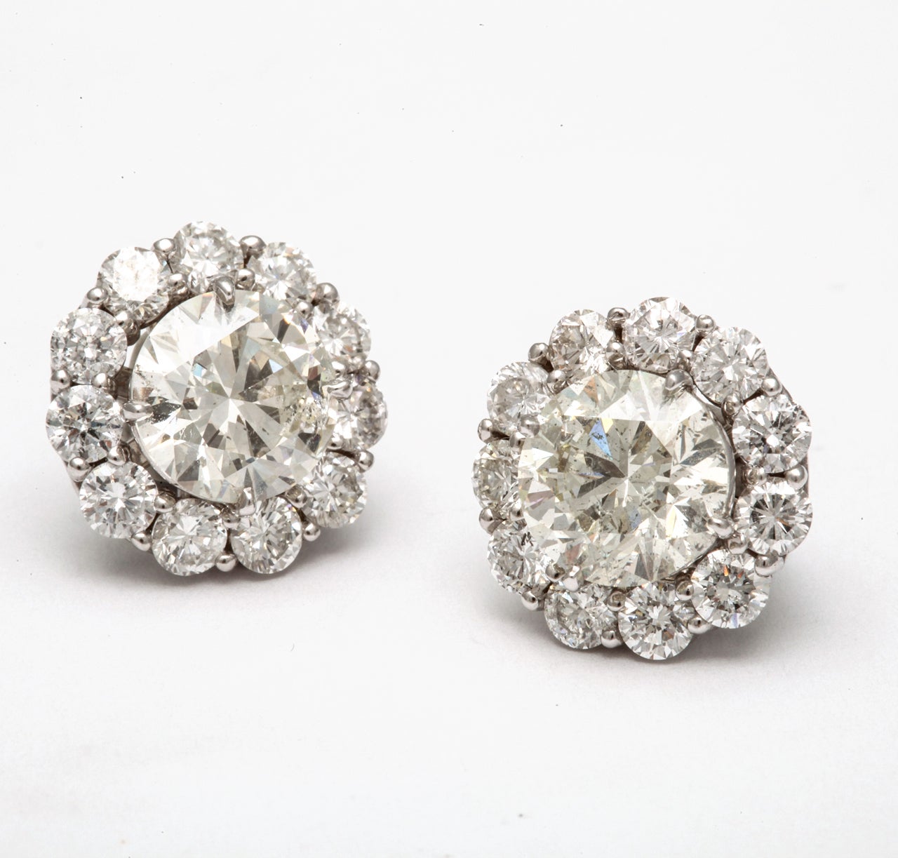 Give an extra sparkle to your studs...these diamond studs weigh 4.84 cts, Color: I, Clarity: SI1-SI2, flanked with removeable diamond jackets, weighing 2.20 carats. Average Stone 0.10 Carats

Available in every size and aveage stone. Please