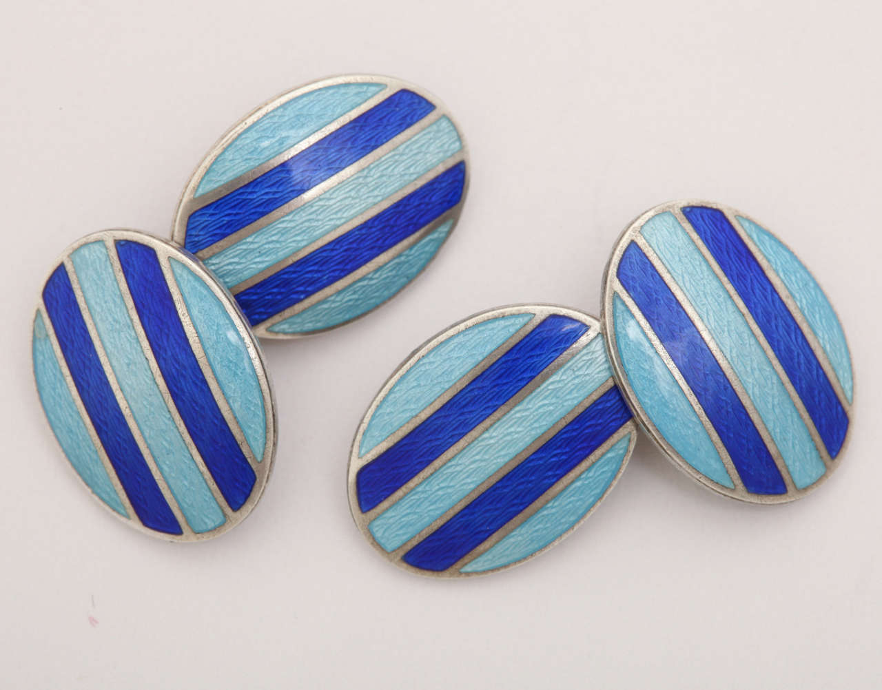 Oval with medium blue and navy blue stripes.
Hallmarks: STERLING