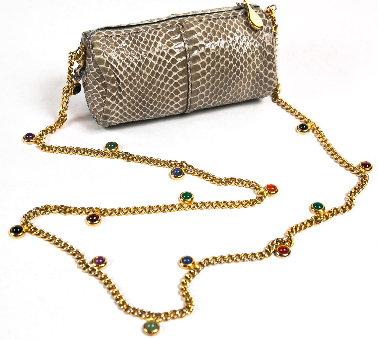 funkyfinders is pleased to share this unusual judith leiber barrel purse with a subdued gray snakeskin surround. its claim to fame is a rather rare jeweled chain. an ideal designer treasure ready to wear year round. simply be ready for