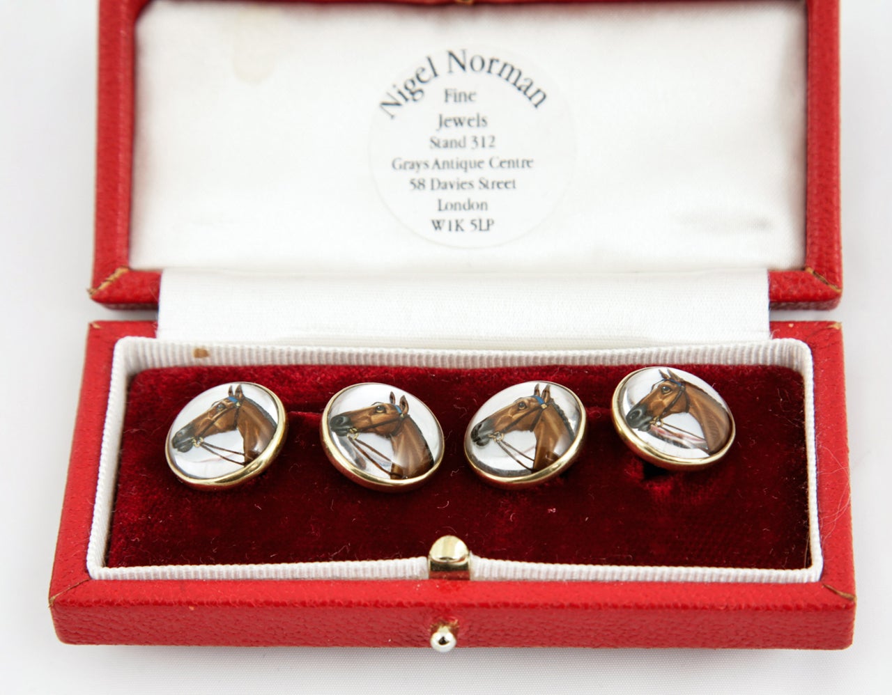 pair of 20th century,18ct gold cufflinks  with enamel,reverse painted race horse heads