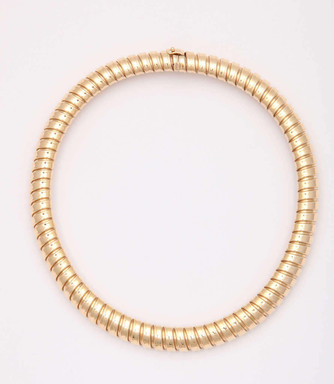 14kt Yellow Gold Expandable rigid Torque.  Fashionable - a stand-out look from the 60's.