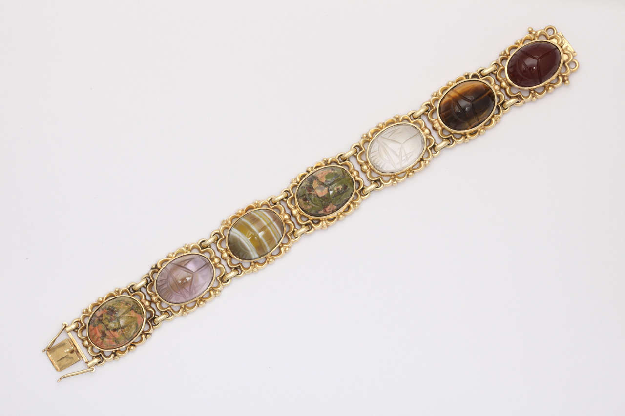 14kt Link Bracelet set with carved scarabs in semi precious stone.  Ca 1940