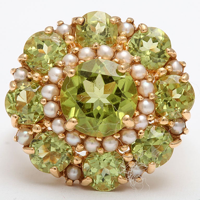 A dazzling French peridot and pearl cocktail ring set in 18kt Gold with French hall-marks