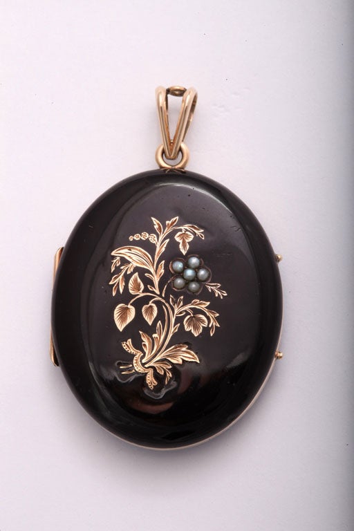 Wonderful Victorian Locket with a bouquet on the front.