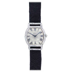 Cartier Lady's Platinum, Gold and Diamond Art Deco Tonneau Wristwatch